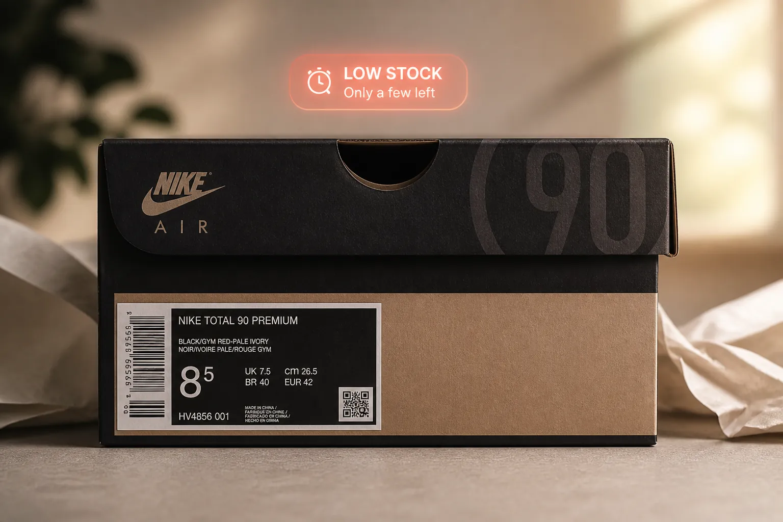 The Nike Total 90 shoe box displayed prominently with a subtle urgency overlay showing limited availability indicator and premium packaging