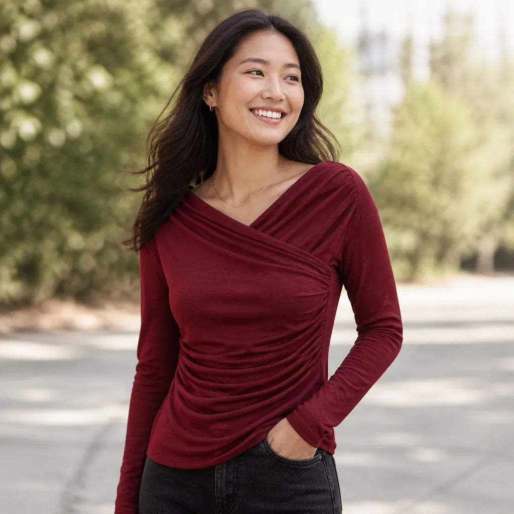 Happy diverse woman smiling confidently while wearing draped surplice top outdoors