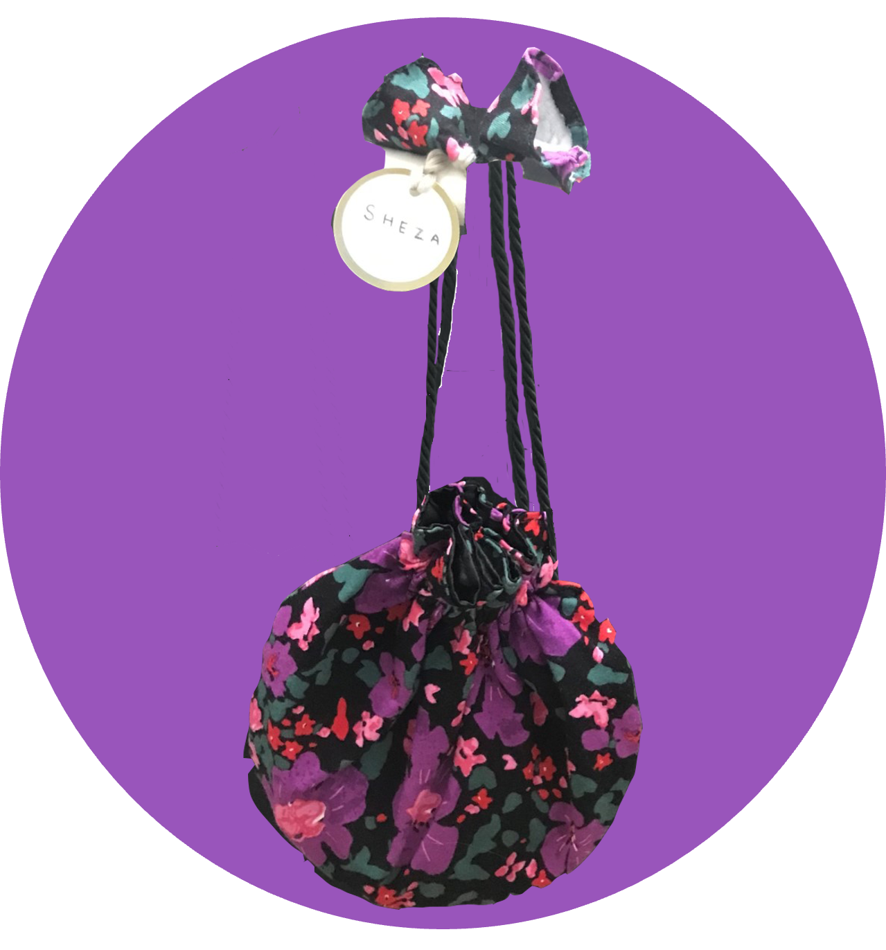 Handmade floral cinch bag with delicate botanical pattern in warm earthy tones, featuring a drawstring closure and natural fabric texture