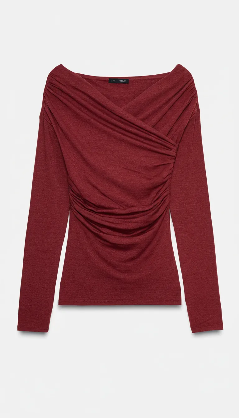 Detailed texture close-up of soft draped fabric showing elegant folds and premium material quality