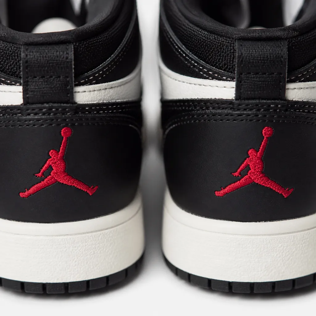 Detailed shot of iconic Jumpman logo embroidered on heel with subtle red accent stitching