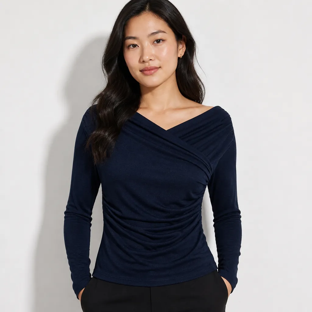 Deep navy blue draped surplice top featured on model in professional studio lighting