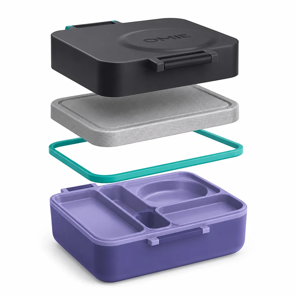 Technical exploded view illustration of the Bento Box showing each layer clearly labeled: the durable outer shell in dark color, the advanced thermal insulation layer, the secure leakproof silicone seal ring, and the compartmentalized inner tray system with multiple sections for organized food storage