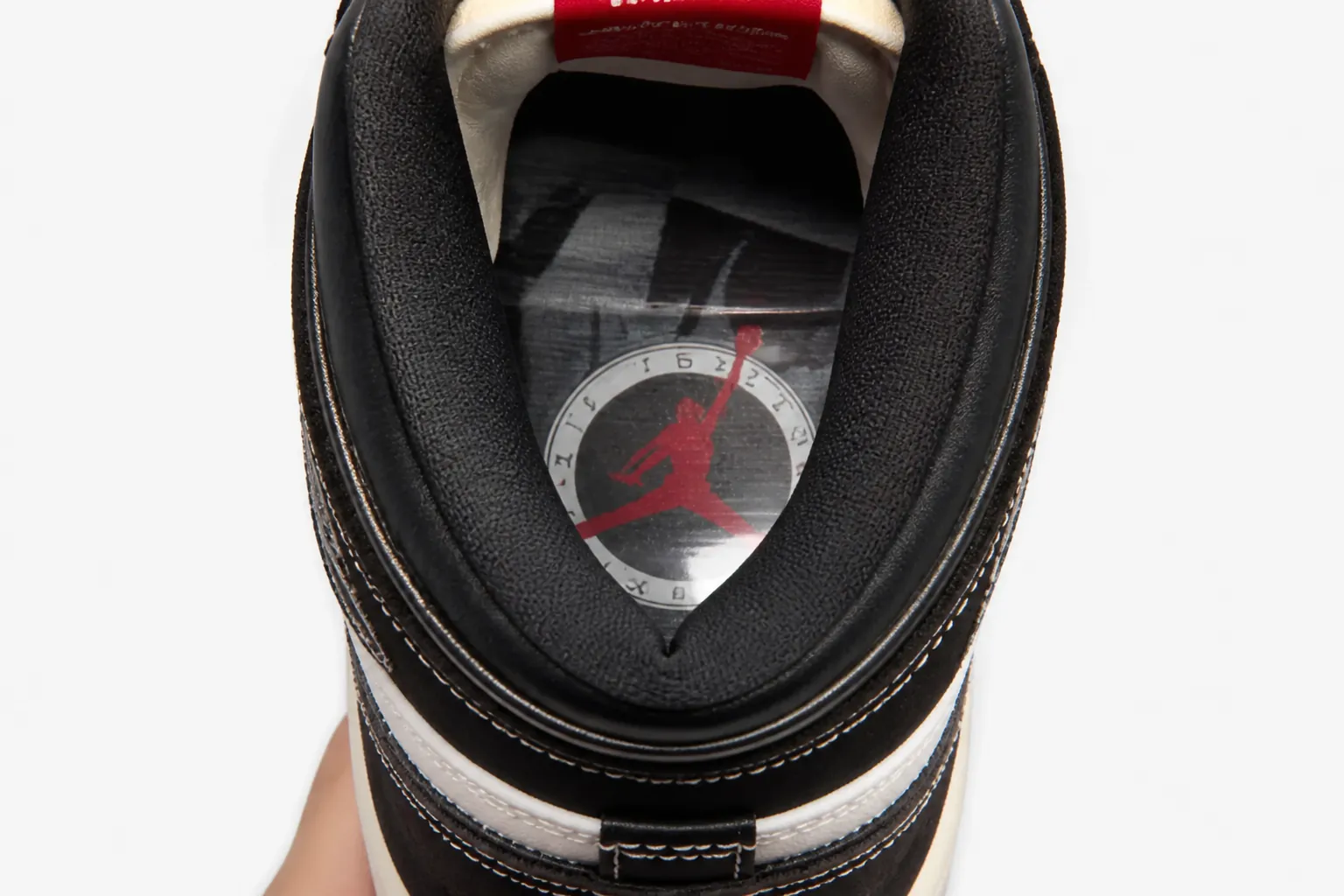 Heel close-up showing encapsulated Nike Air-Sole unit with visible air cushioning technology and premium construction detail