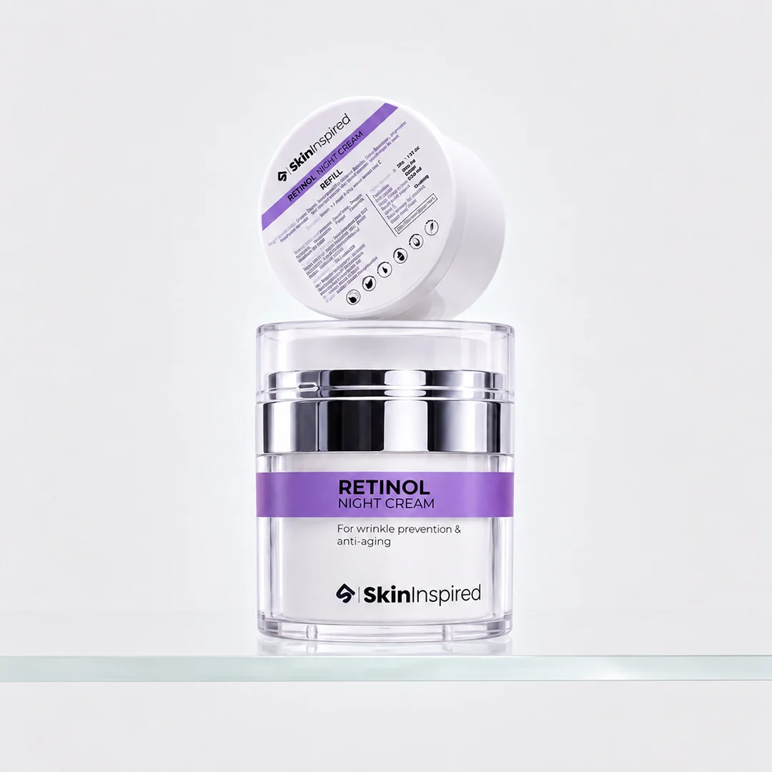 Lifestyle shot of premium Retinol Night Cream jar elegantly positioned on white marble surface surrounded by fresh rose petals and botanical elements, high-end magazine editorial composition with soft natural lighting